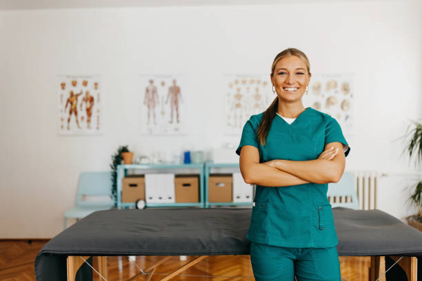 A physical therapist smiling at the camera