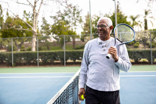 Old man holding a tennis racket